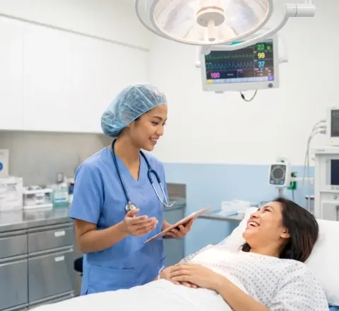 Trained nurse checking a patient's blood pressure at home